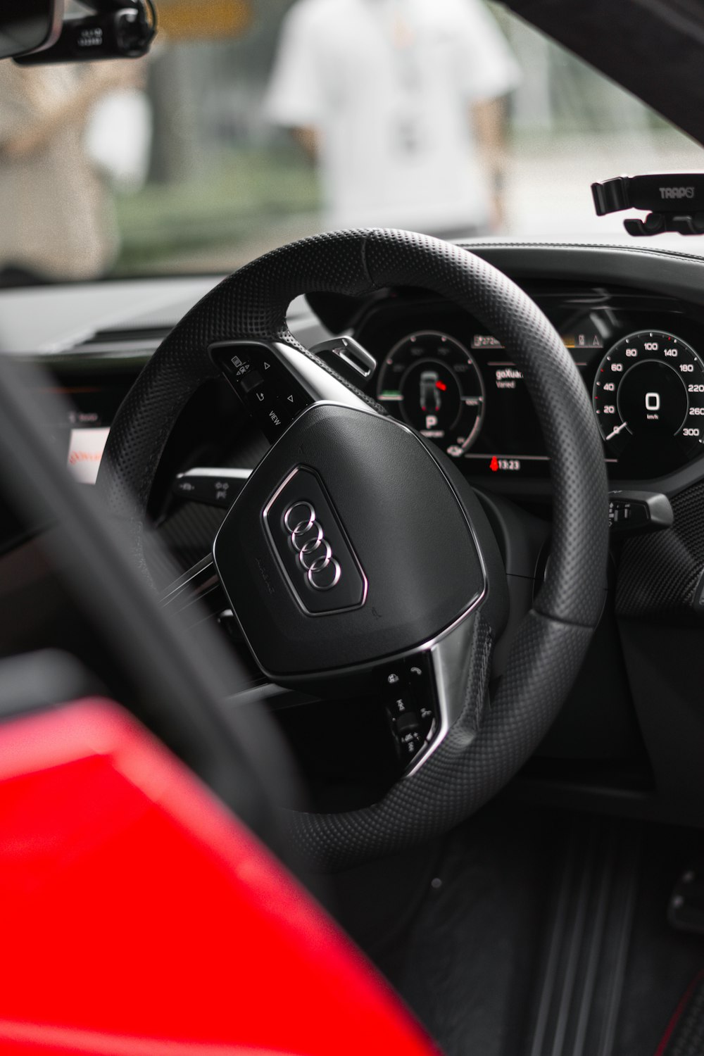 the interior of a car with a steering wheel and dashboard