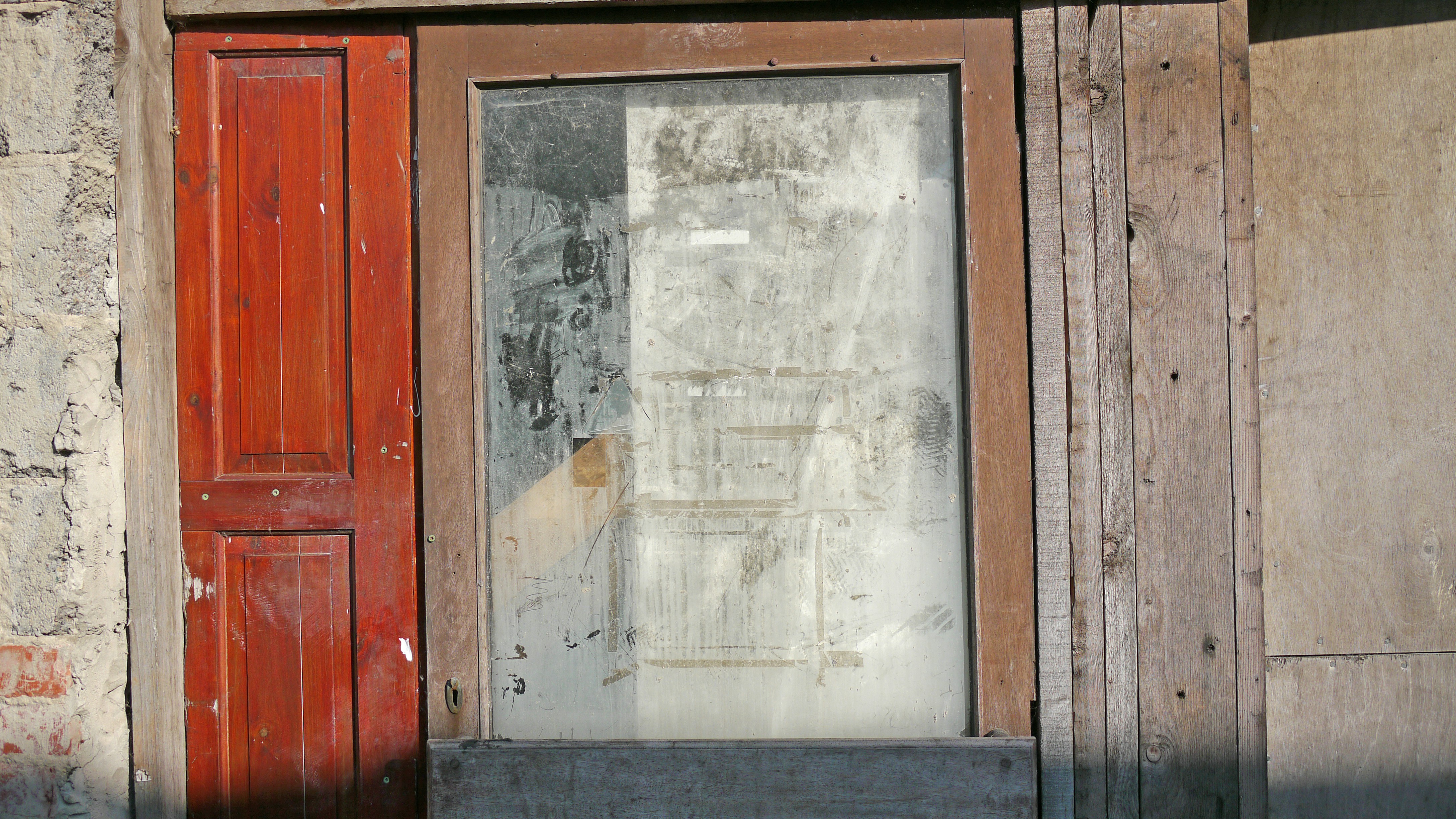 a red door and window on a building