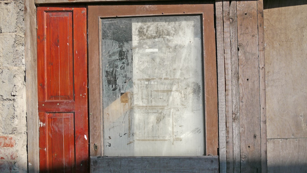 a red door and window on a building