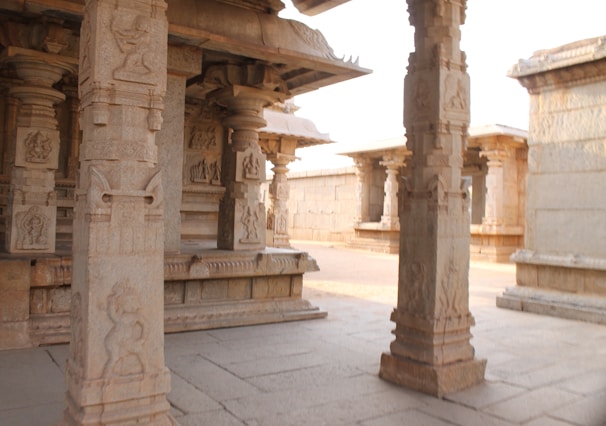Intricate stone carvings illuminated by soft morning light