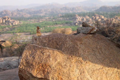 Large limestone rocks stacked outdoors under a clear sky