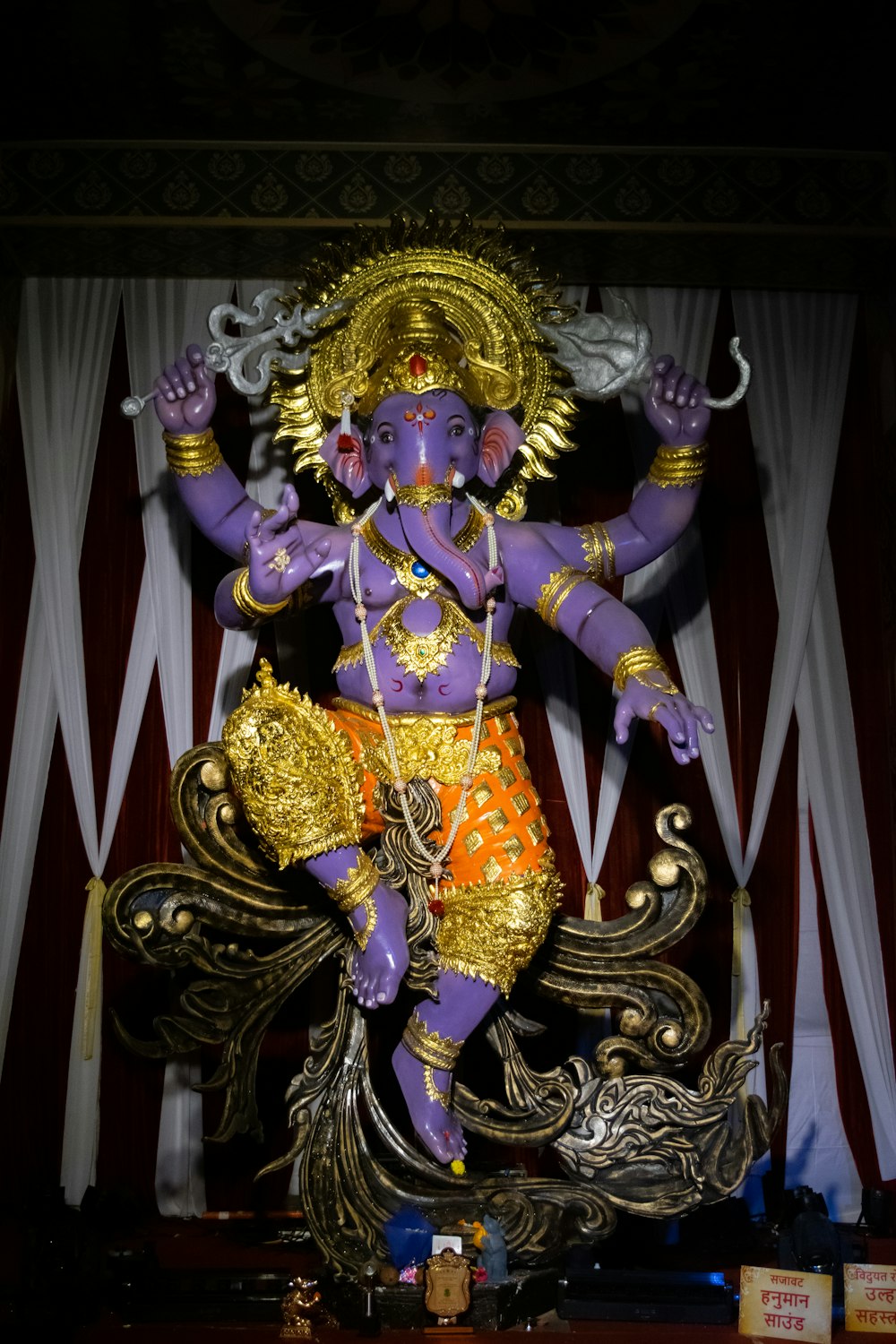 a statue of an indian god in a temple