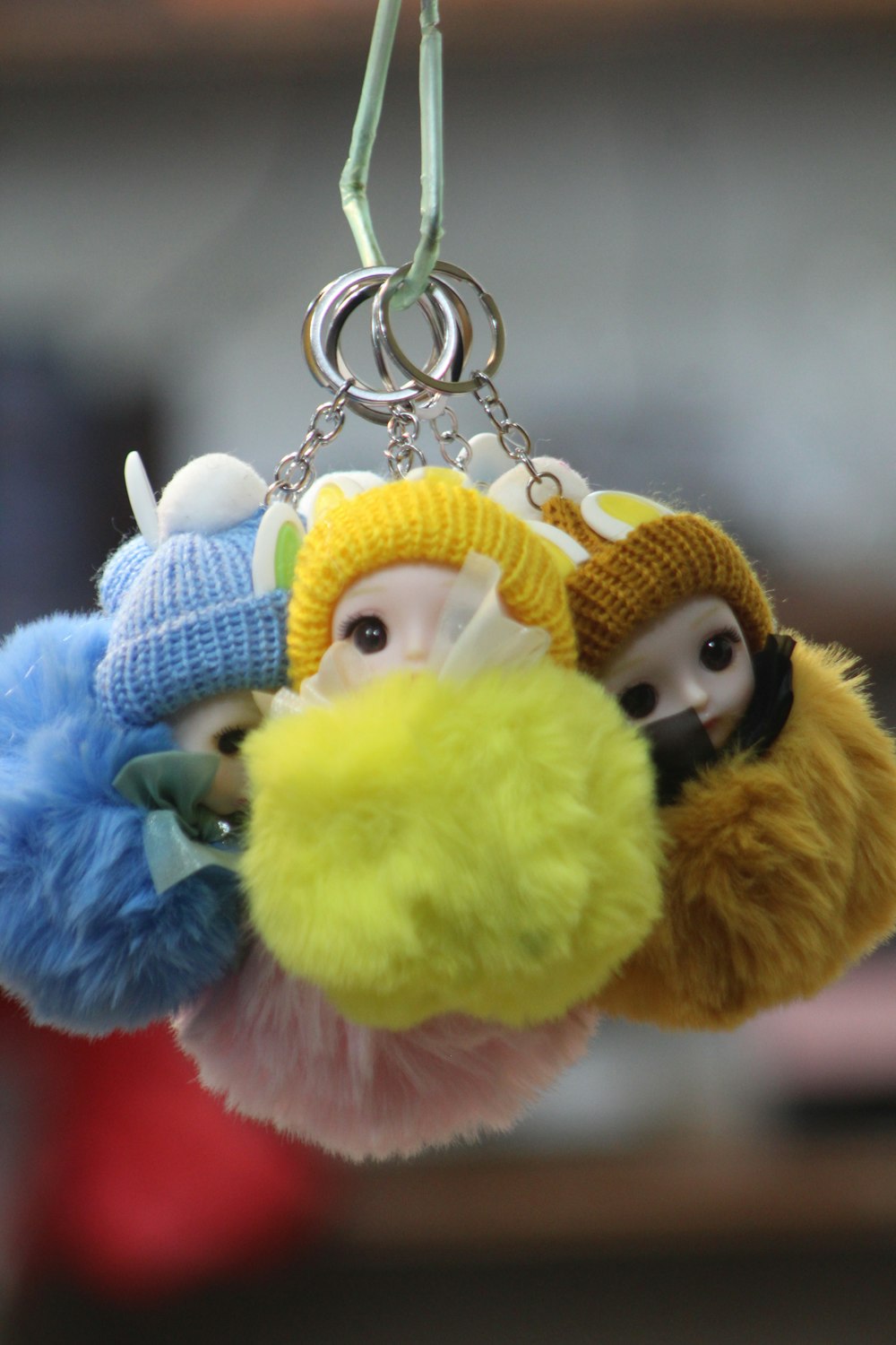 a couple of stuffed animals hanging from a key chain
