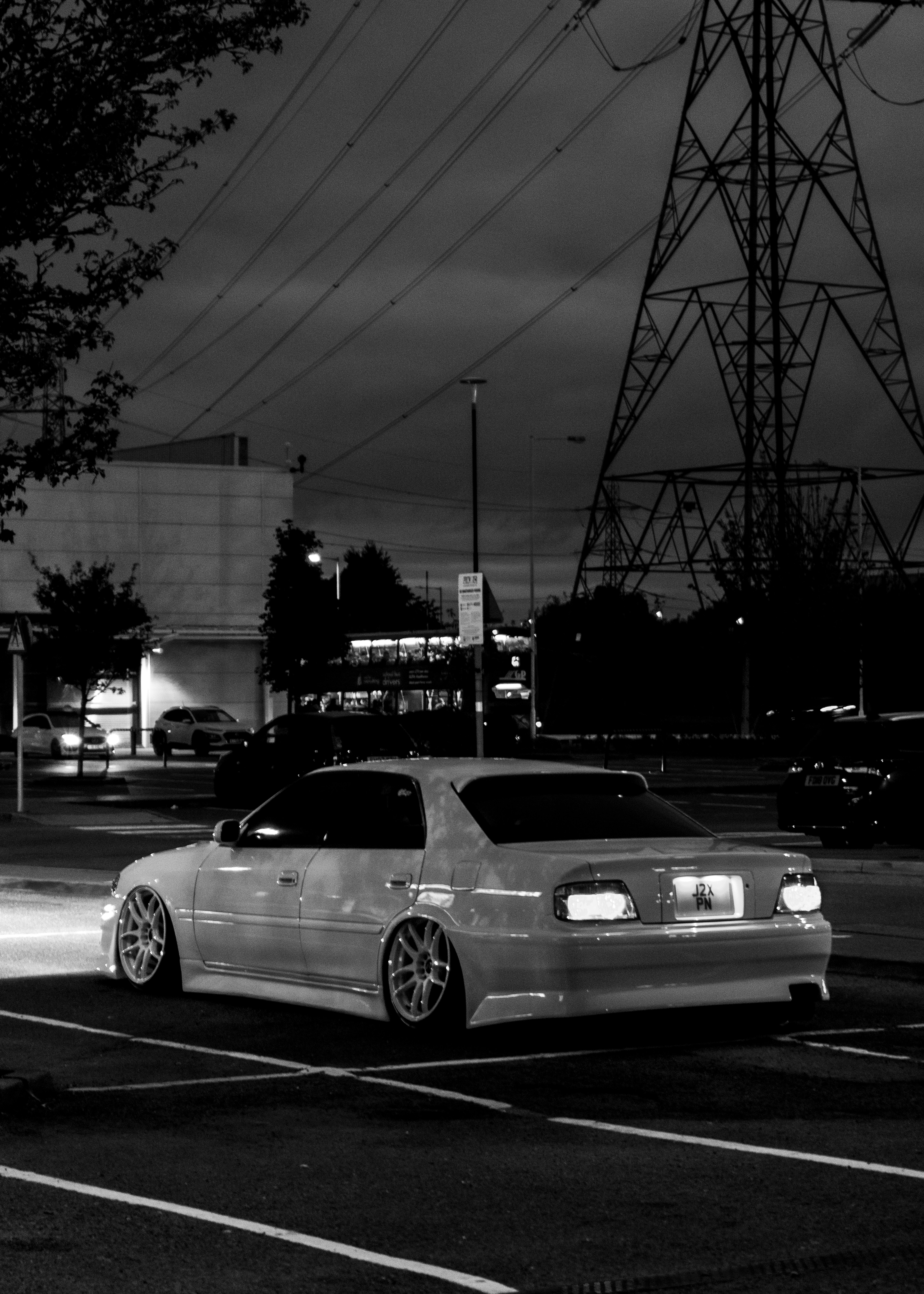 a car parked in a parking lot at night