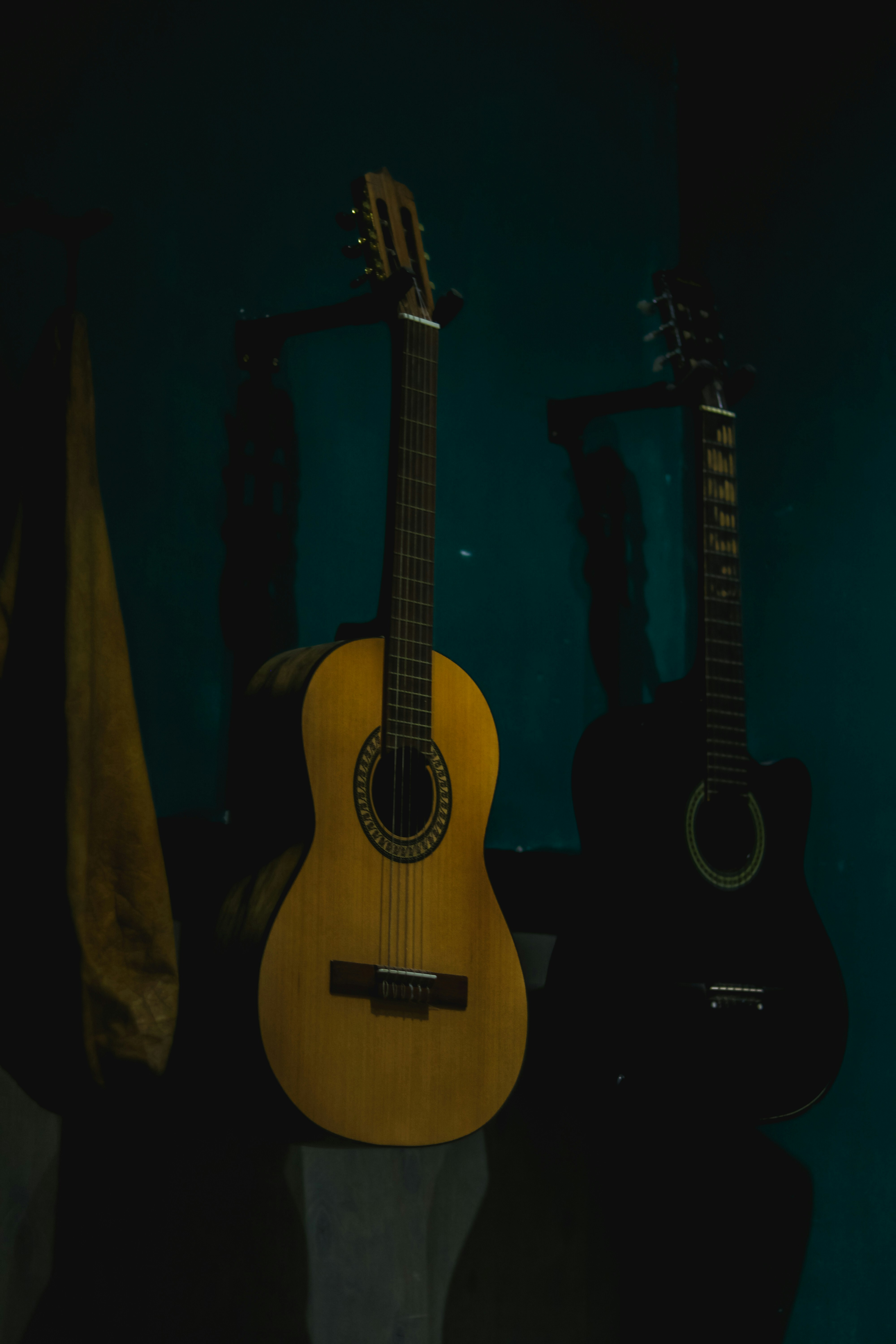 a couple of guitars sitting on top of a table