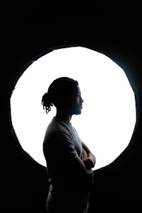 A serene person confidently saying 'no' with a glowing aura symbolizing empowerment.