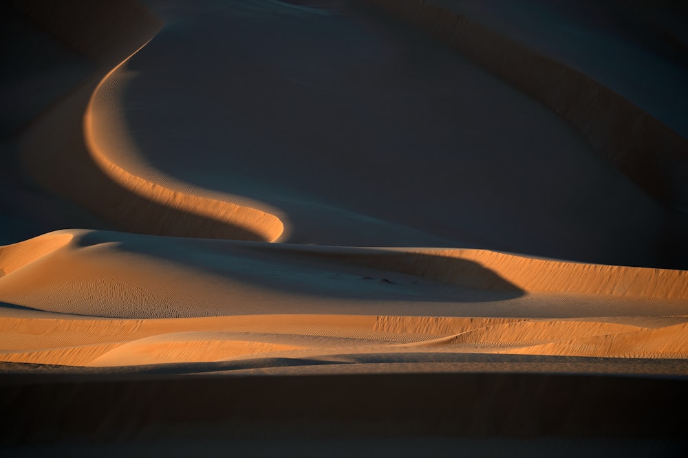 a sand dune in the middle of a desert