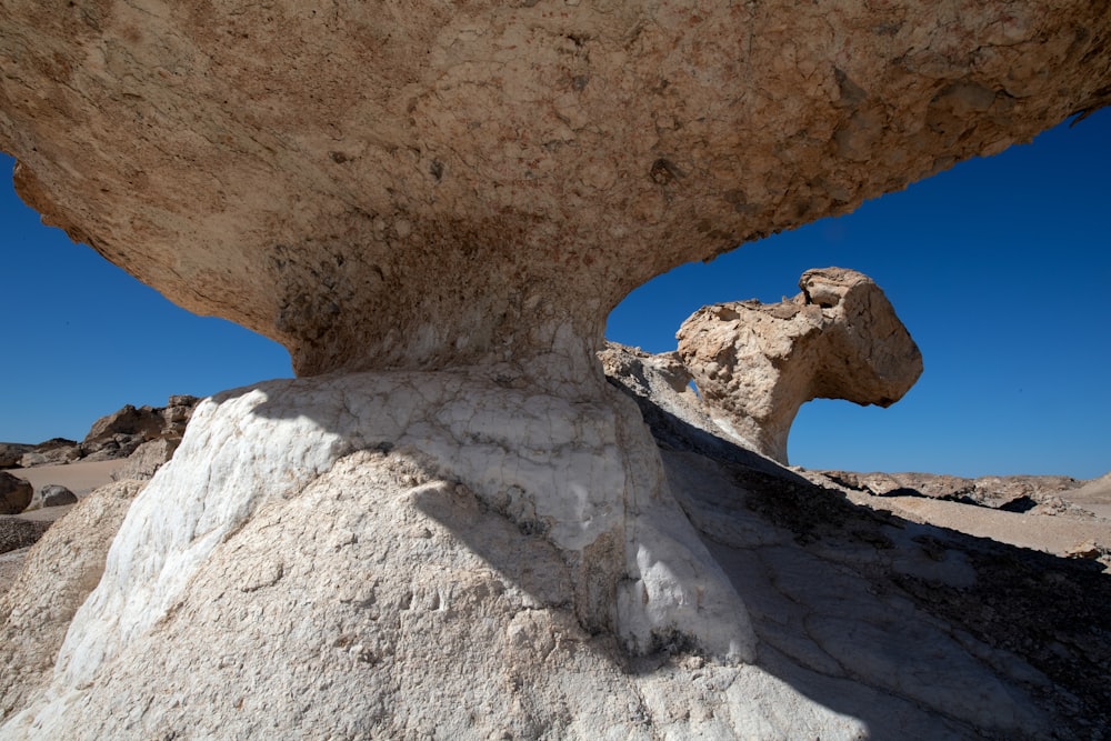 a rock formation in the middle of a desert