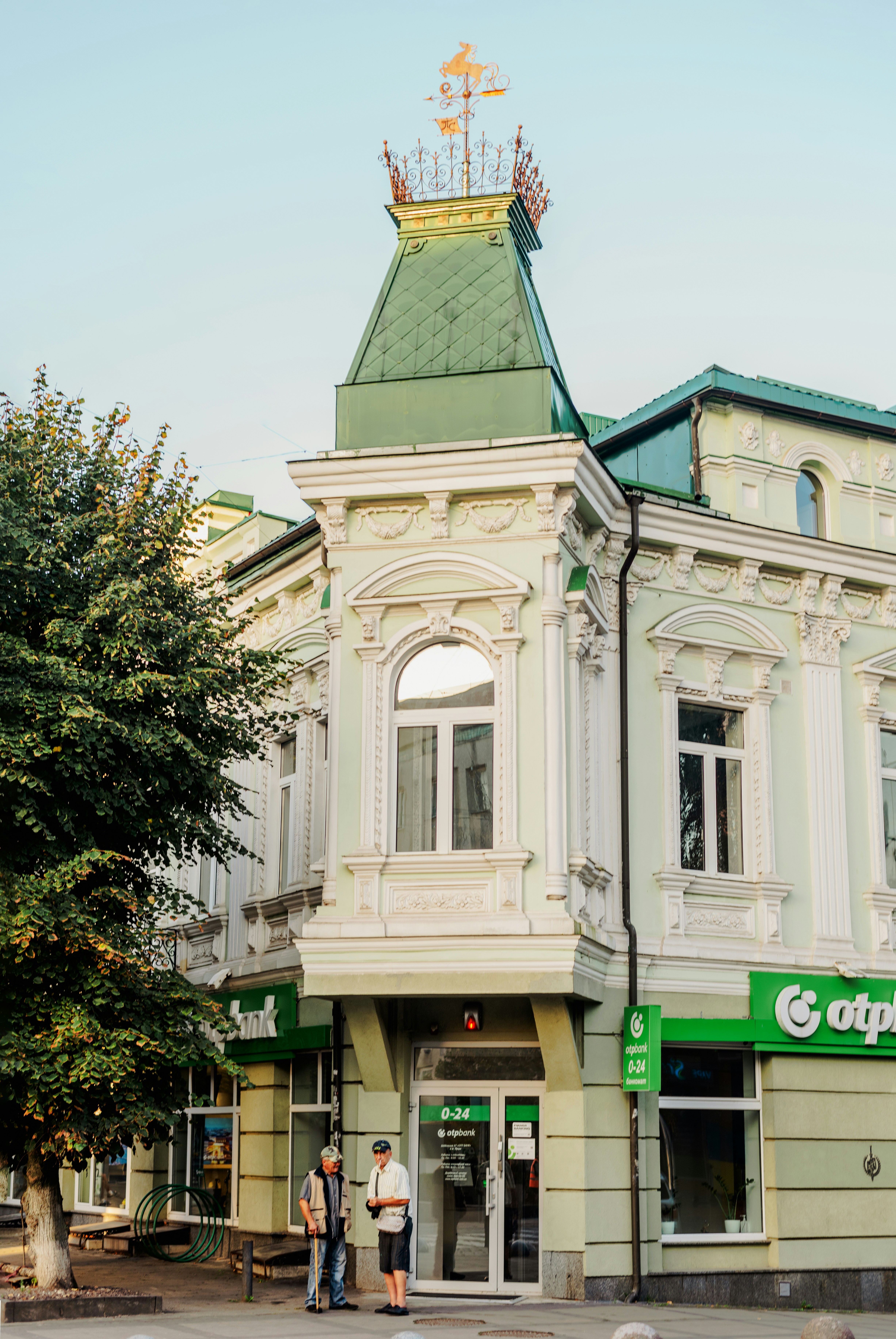 a couple of people standing in front of a building