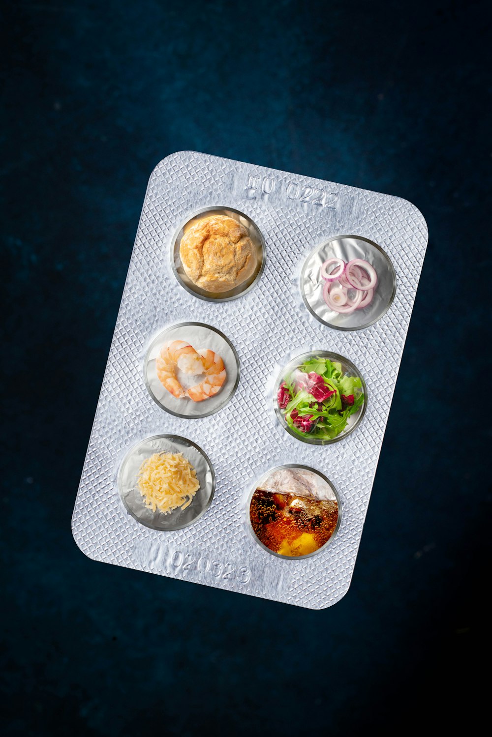 a tray of food on a blue table