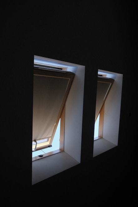 a couple of windows in a dark room