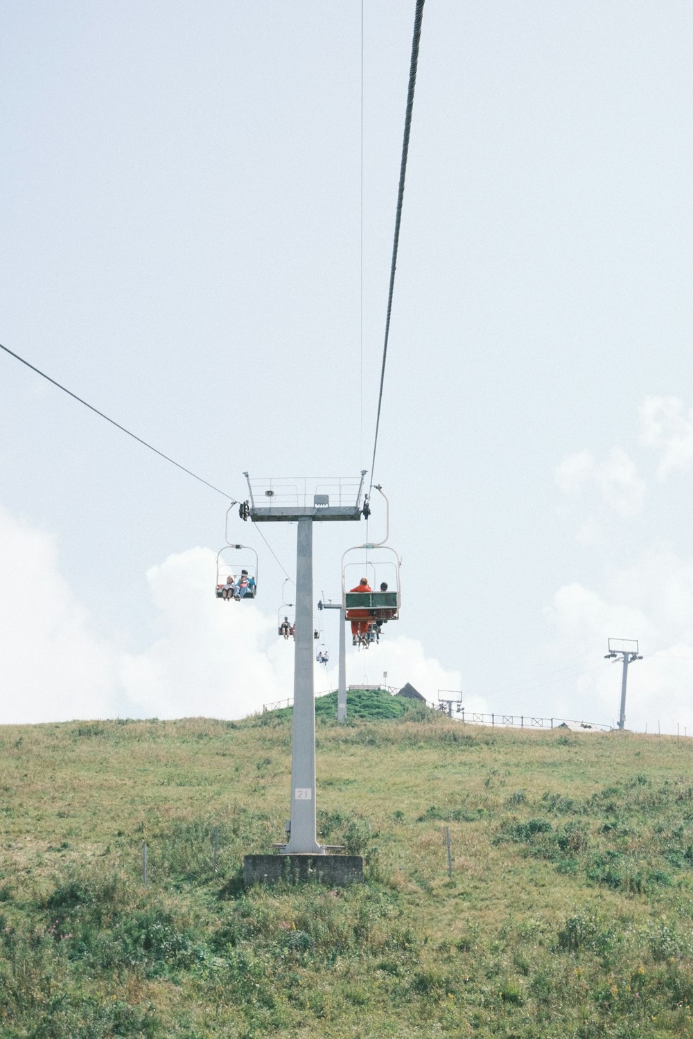 a couple of people riding a ski lift