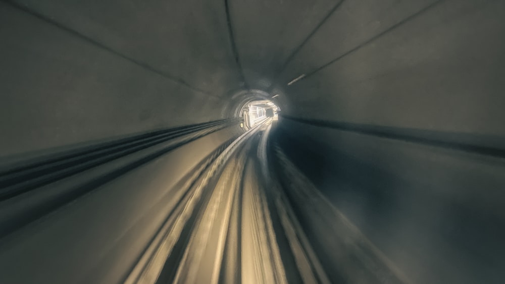a train traveling through a tunnel in the middle of the night
