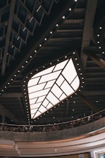 Modern restaurant interior showcasing glowing backlit stretch ceiling panels.