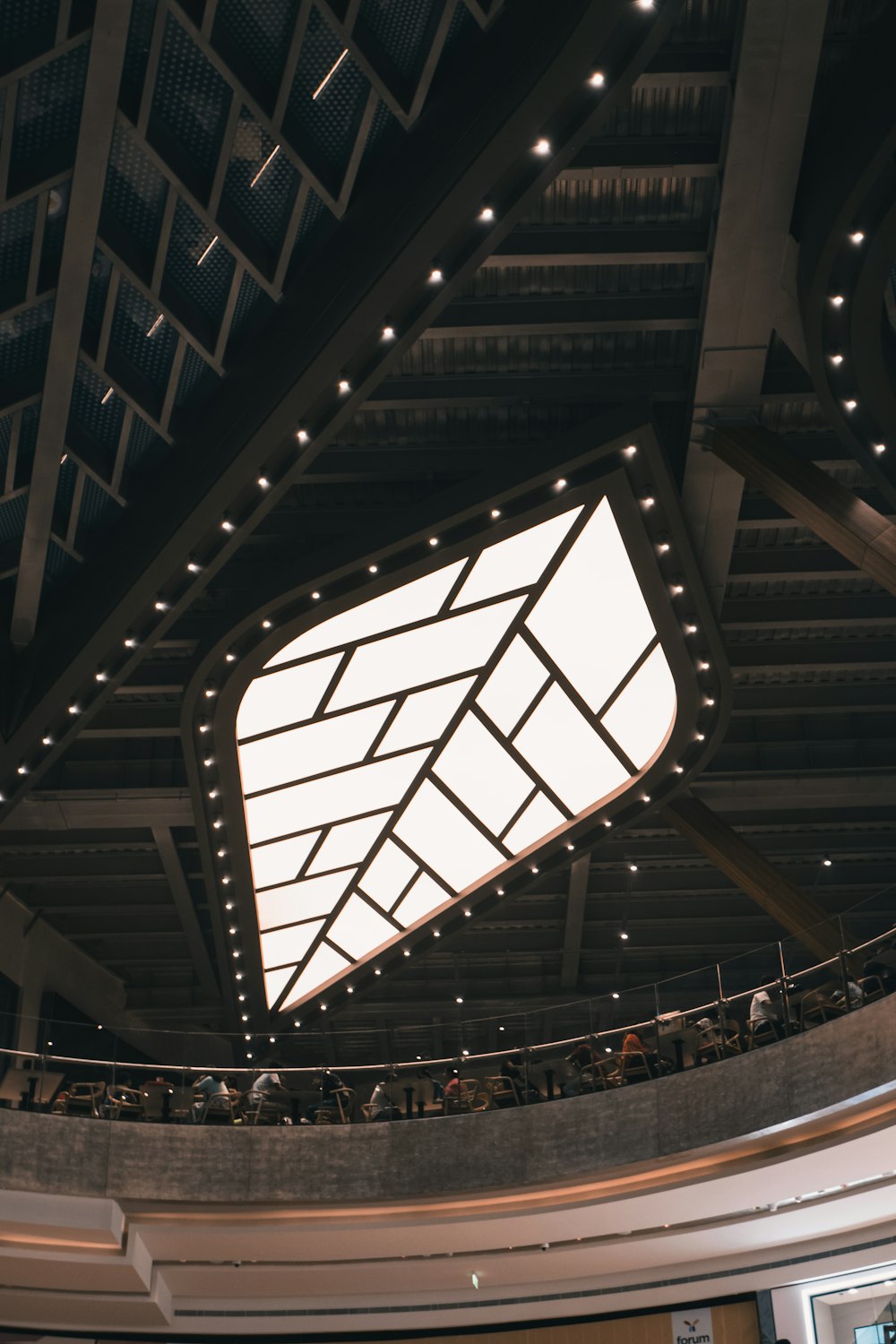 the ceiling of a building with a large square window