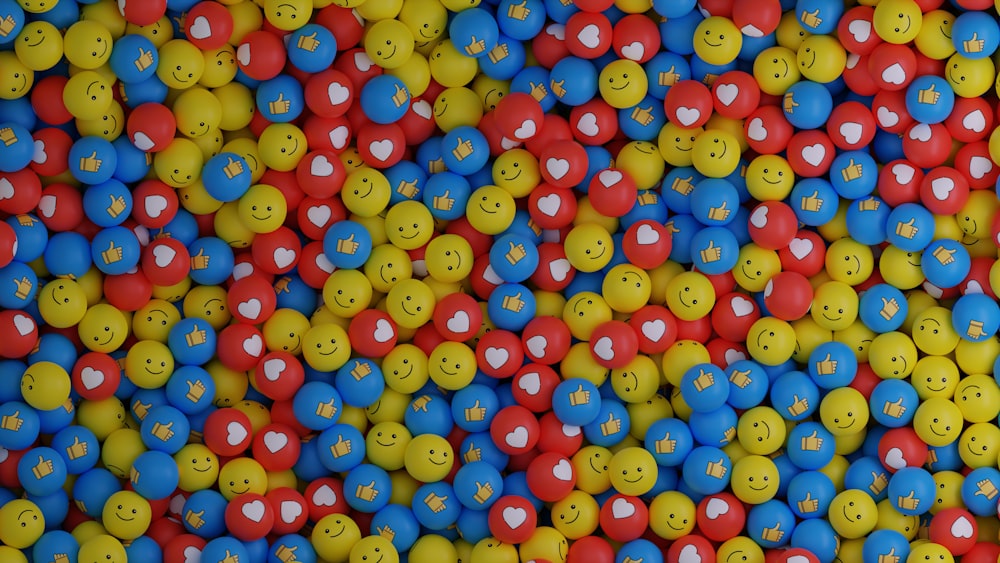 a bunch of balls with smiley faces on them
