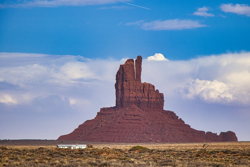 a large rock formation in the middle of a desert