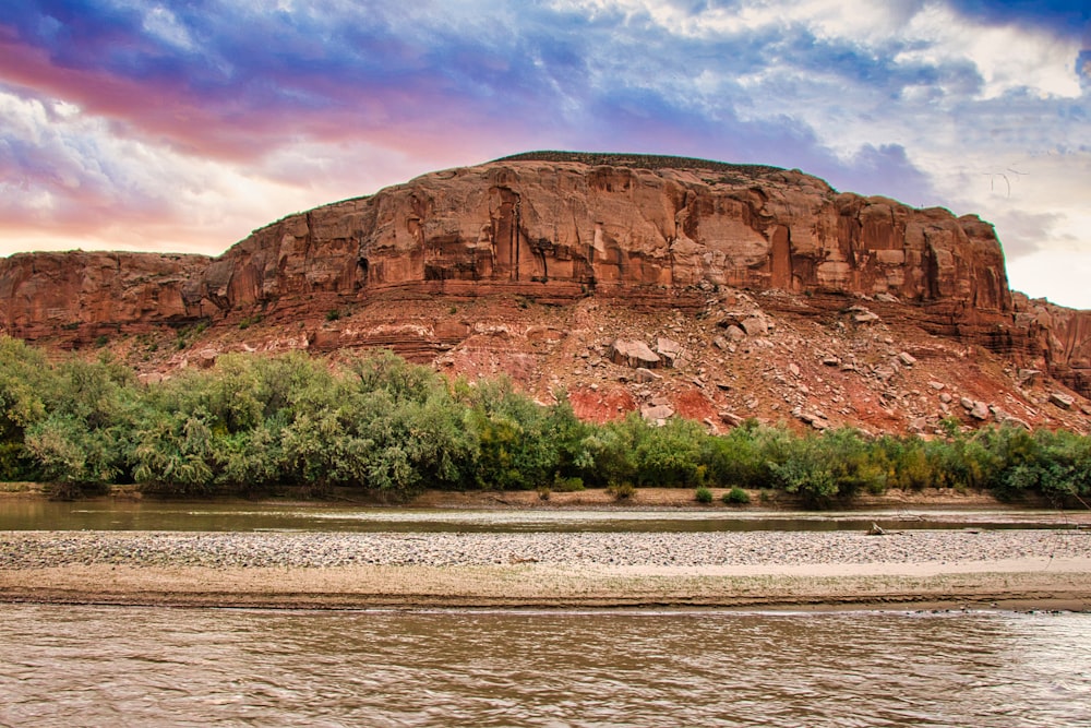 a river with a mountain in the background