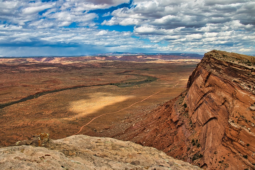 a scenic view of a valley with a river running through it