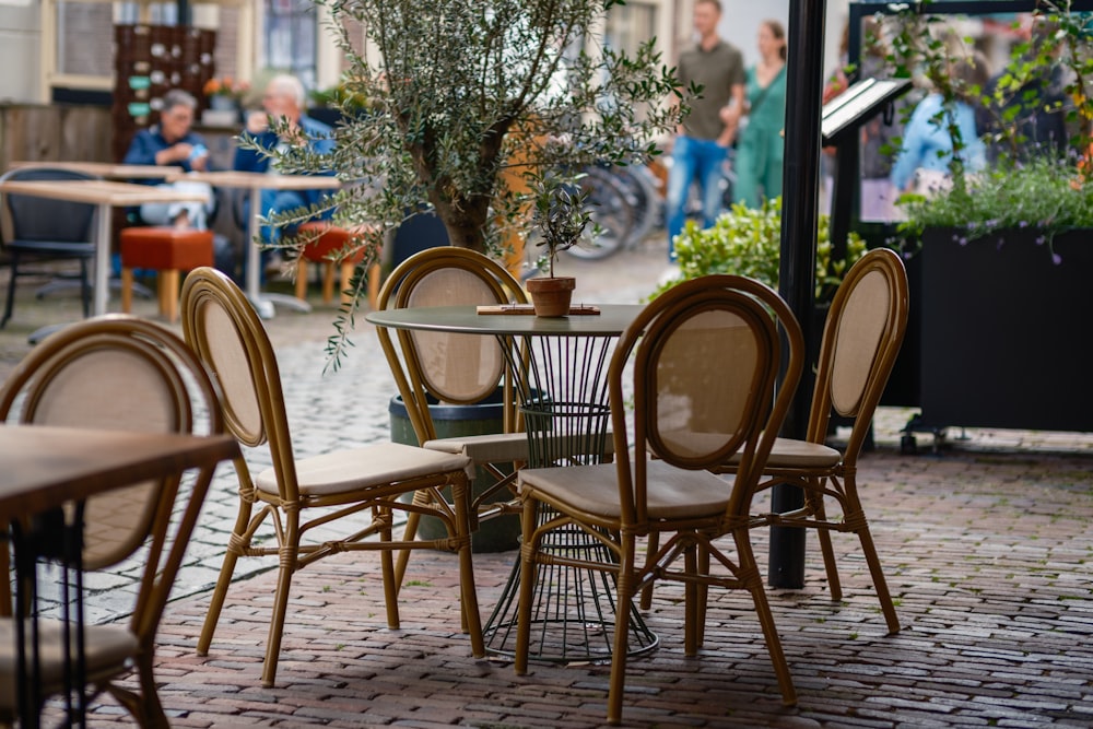 a group of tables and chairs sitting on a brick patio