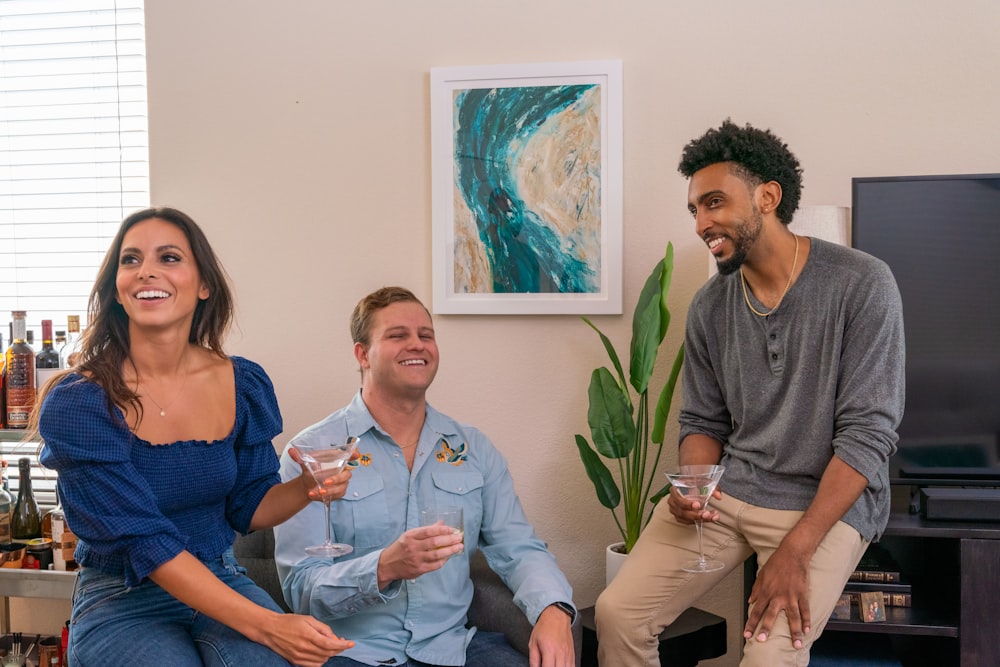 a group of people sitting around a living room together