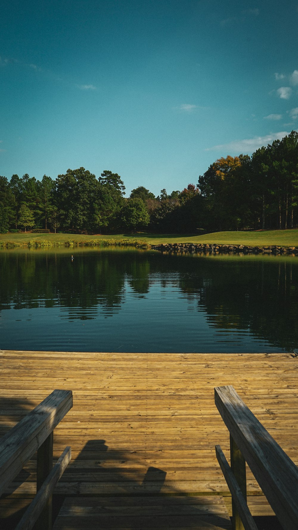 a wooden dock sitting next to a body of water
