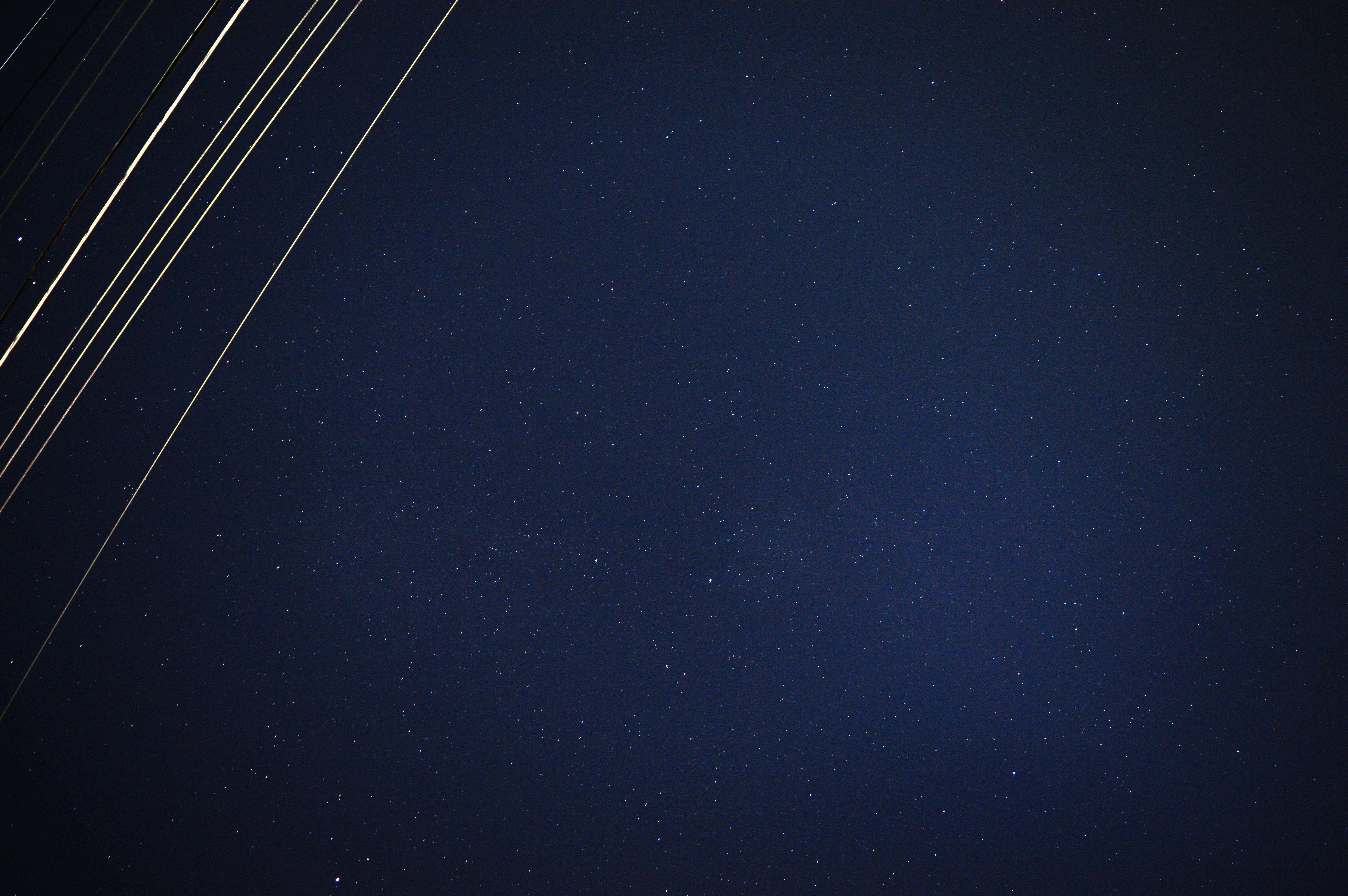 a group of airplanes flying through the night sky