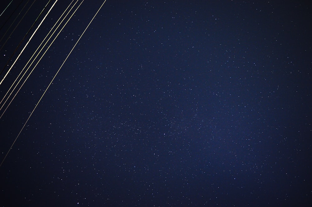 a group of airplanes flying through the night sky
