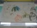 A child’s drawing rendered with colorful crayons on paper, depicting various playful and abstract figures including animals and objects. The artwork is simple, with scribbled lines and imaginative shapes. The picture features smiling faces and abstract forms, conveying a sense of creativity and innocence.