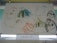 A child’s drawing rendered with colorful crayons on paper, depicting various playful and abstract figures including animals and objects. The artwork is simple, with scribbled lines and imaginative shapes. The picture features smiling faces and abstract forms, conveying a sense of creativity and innocence.