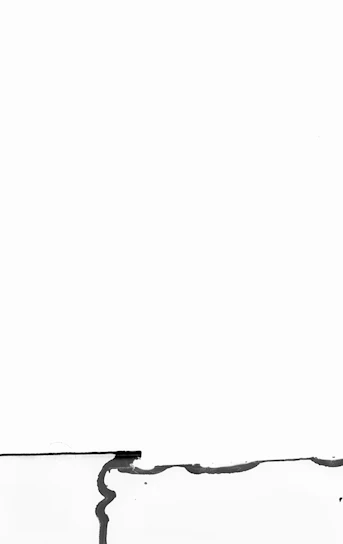 Minimalist navy and white abstract shapes representing airflow and simplicity.