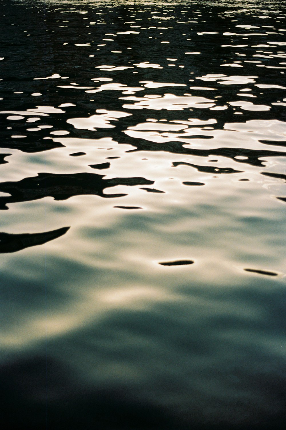 a boat floating on top of a body of water