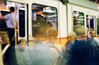 A fleeting glimpse of smiles exchanged in a bustling metro station.