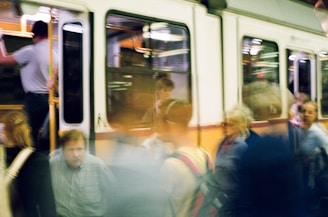A fleeting glimpse of smiles exchanged in a bustling metro station.
