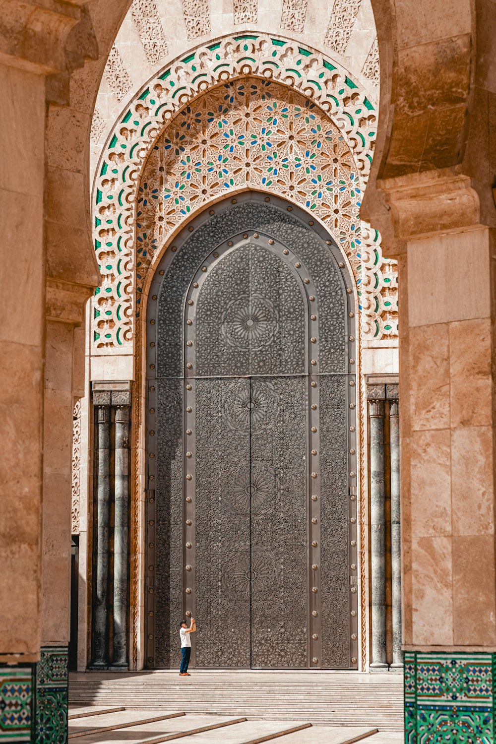 a person standing in front of a large door