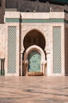 a building with a green and white door