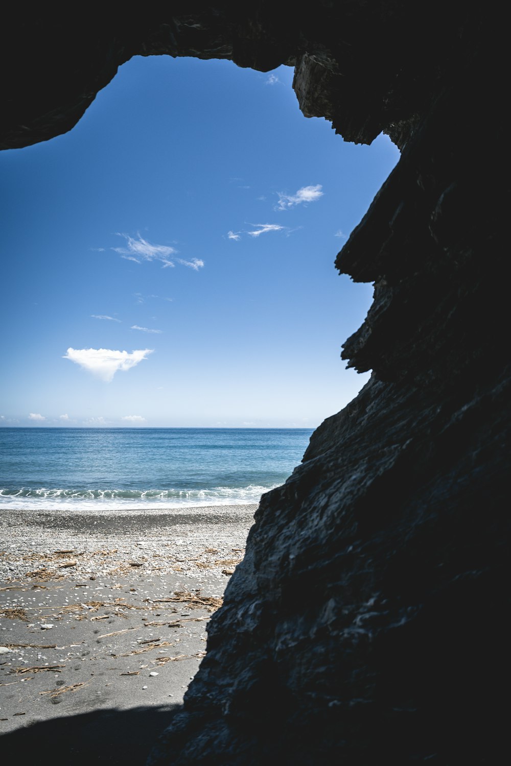 a view of the ocean from inside a cave