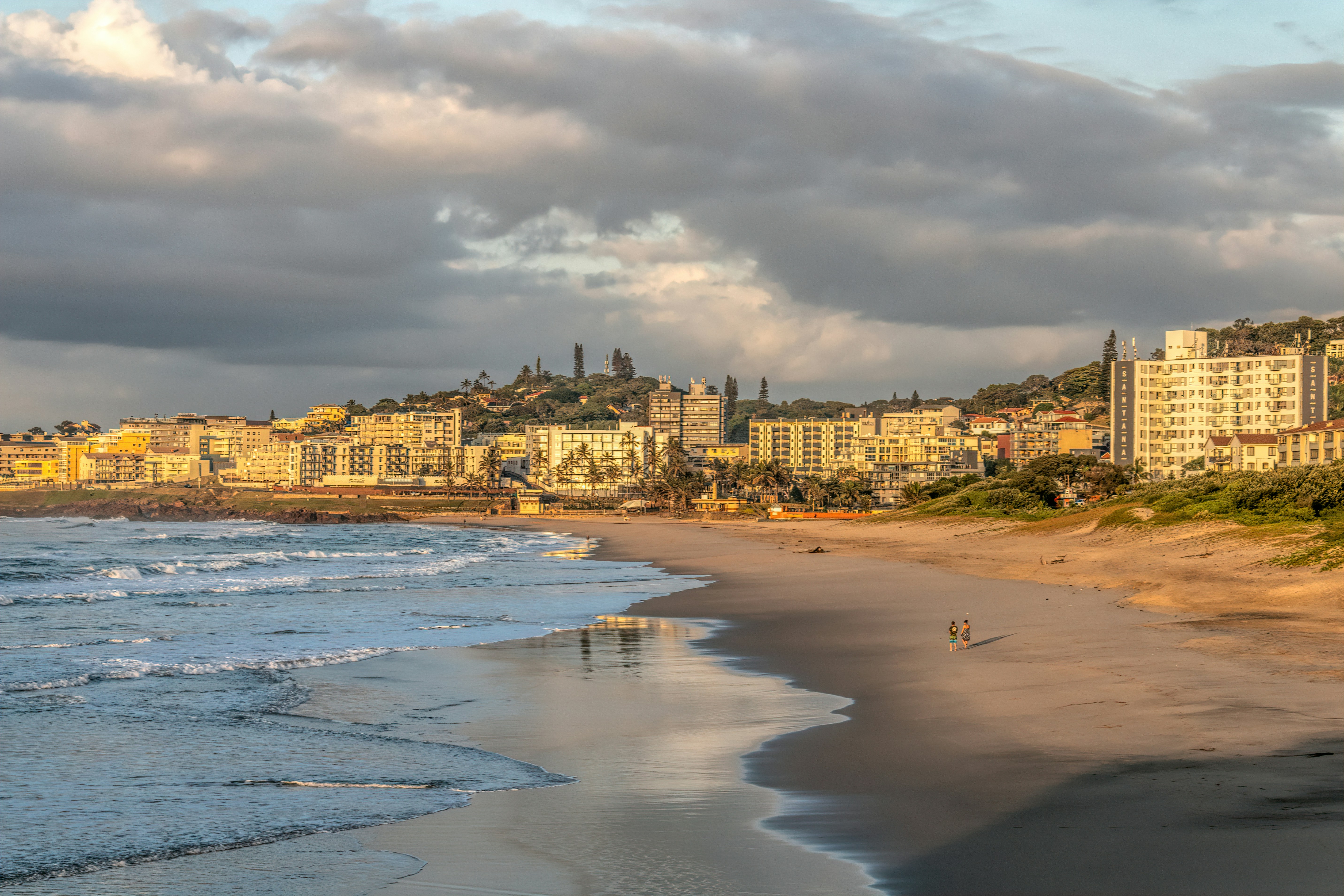 a beach with a city in the background, The Golden Mile, Margate, KZN