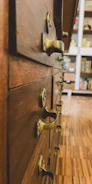 Before-and-after image of a vintage mahogany dresser with refinished surface and new brass handles