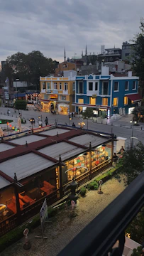 A vibrant street view of Hyderabad showcasing residential buildings and bustling local life.
