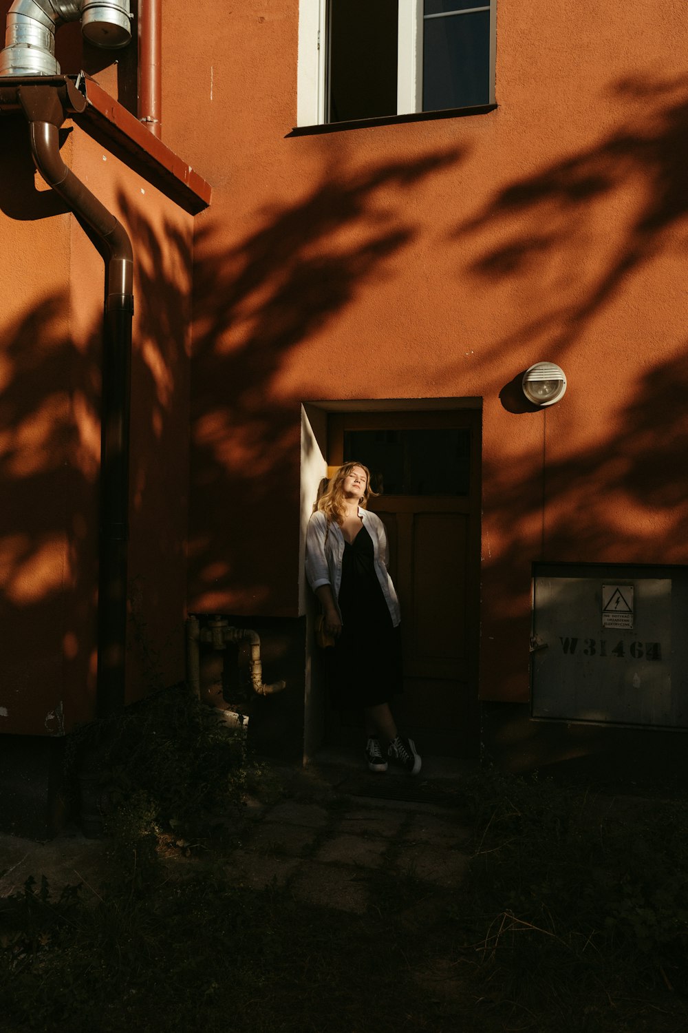 a woman standing in a doorway of a building