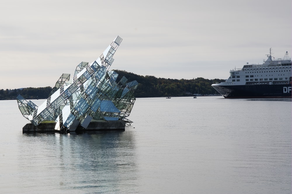 a sculpture in the middle of a body of water