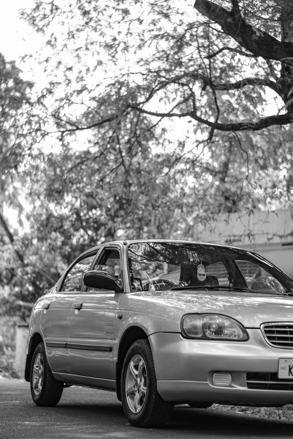 a silver car parked on the side of the road