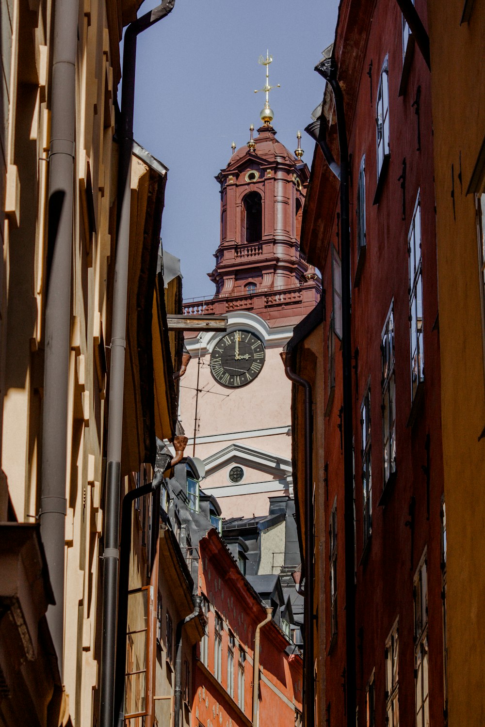 a tall clock tower towering over a city