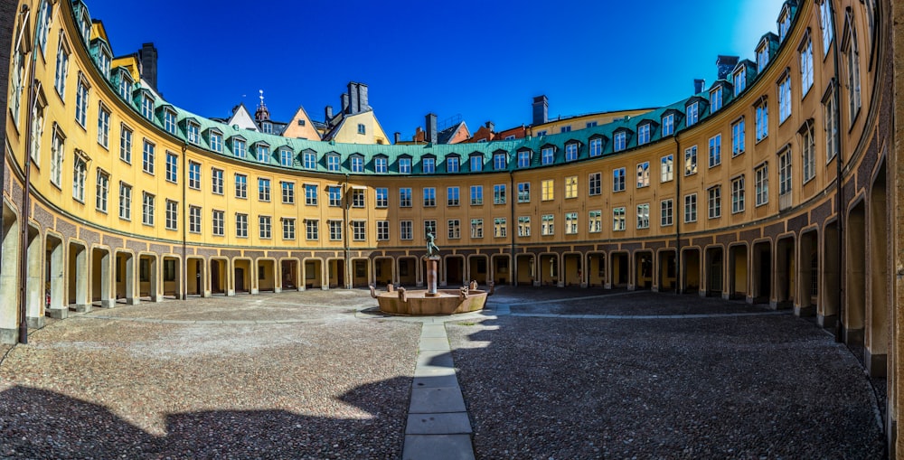 a circular building with a fountain inside of it