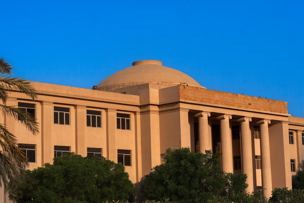 a large building with columns and a dome