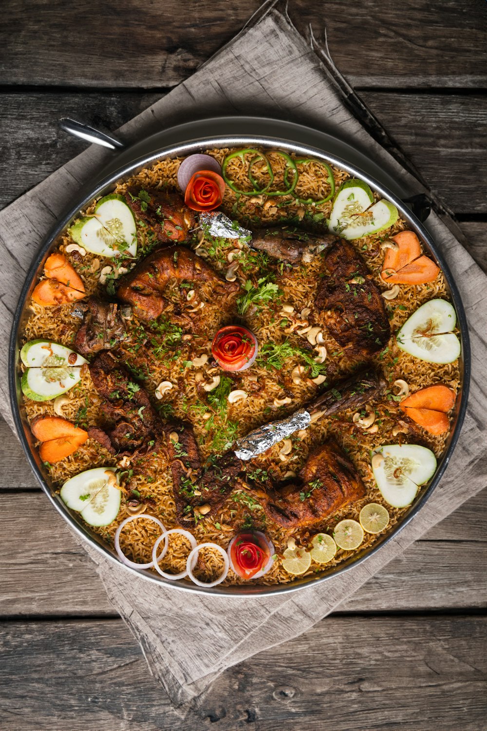 a large platter of food on a wooden table