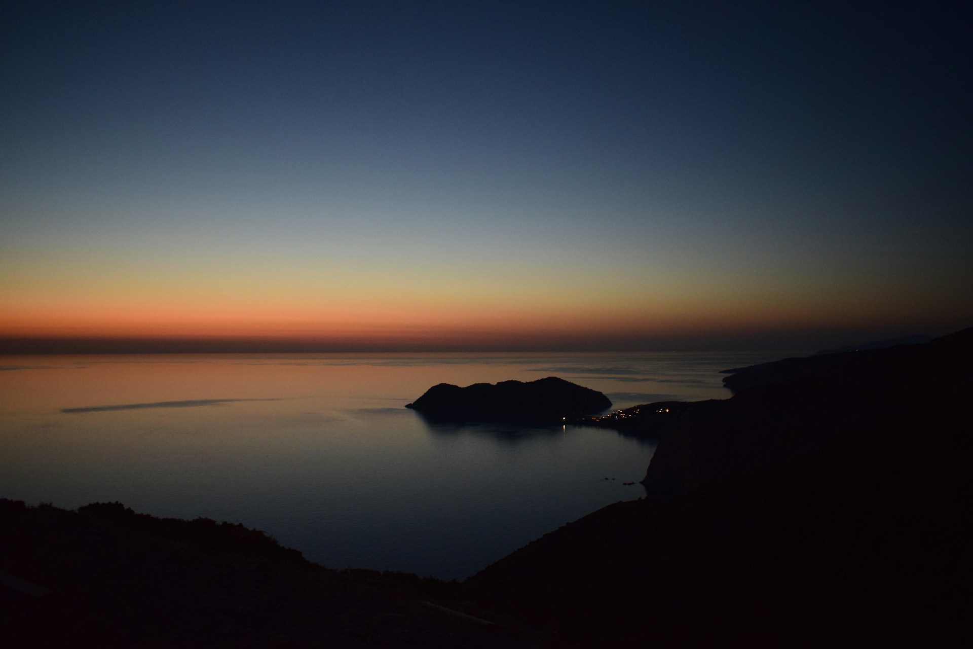 a view of a body of water at sunset