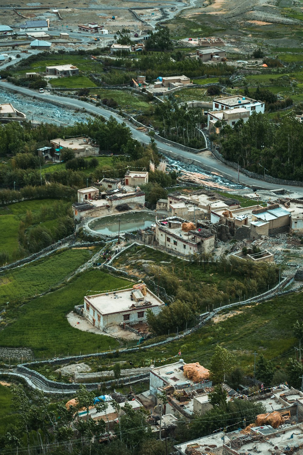 an aerial view of a town with a river running through it