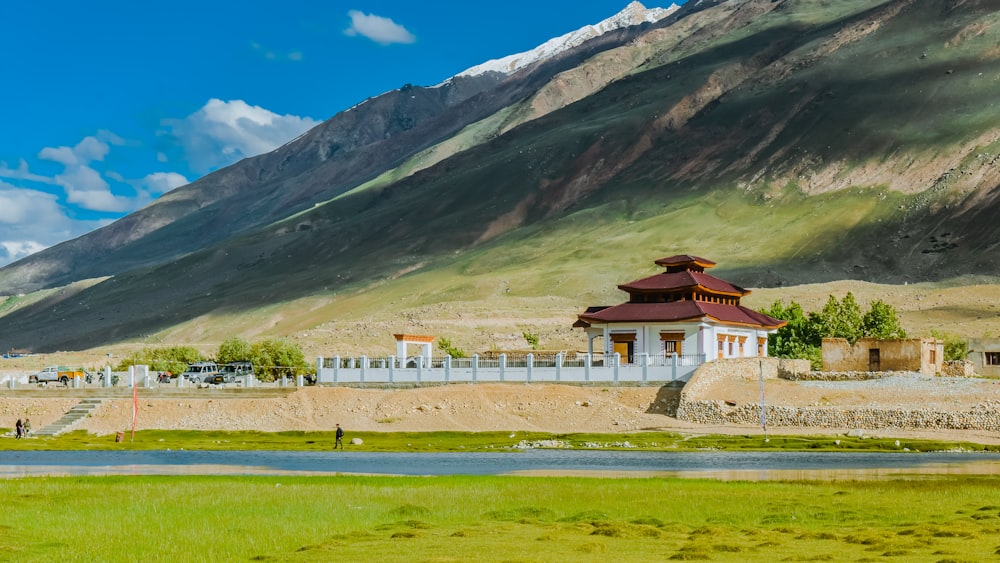 a small building in the middle of a field